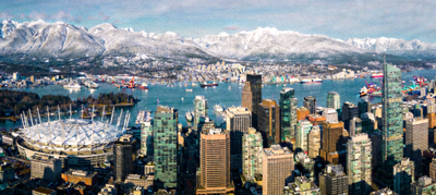 温哥华市中心天际线与BC Place体育场，背景是雪山与海港，展现自然与城市融合